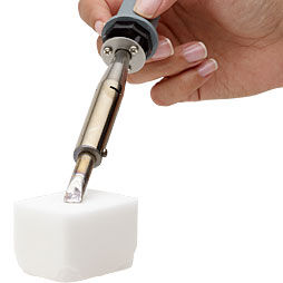 Soldering iron touching ammoniac block